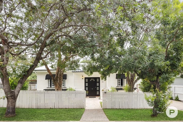 house with garden and white picket fence